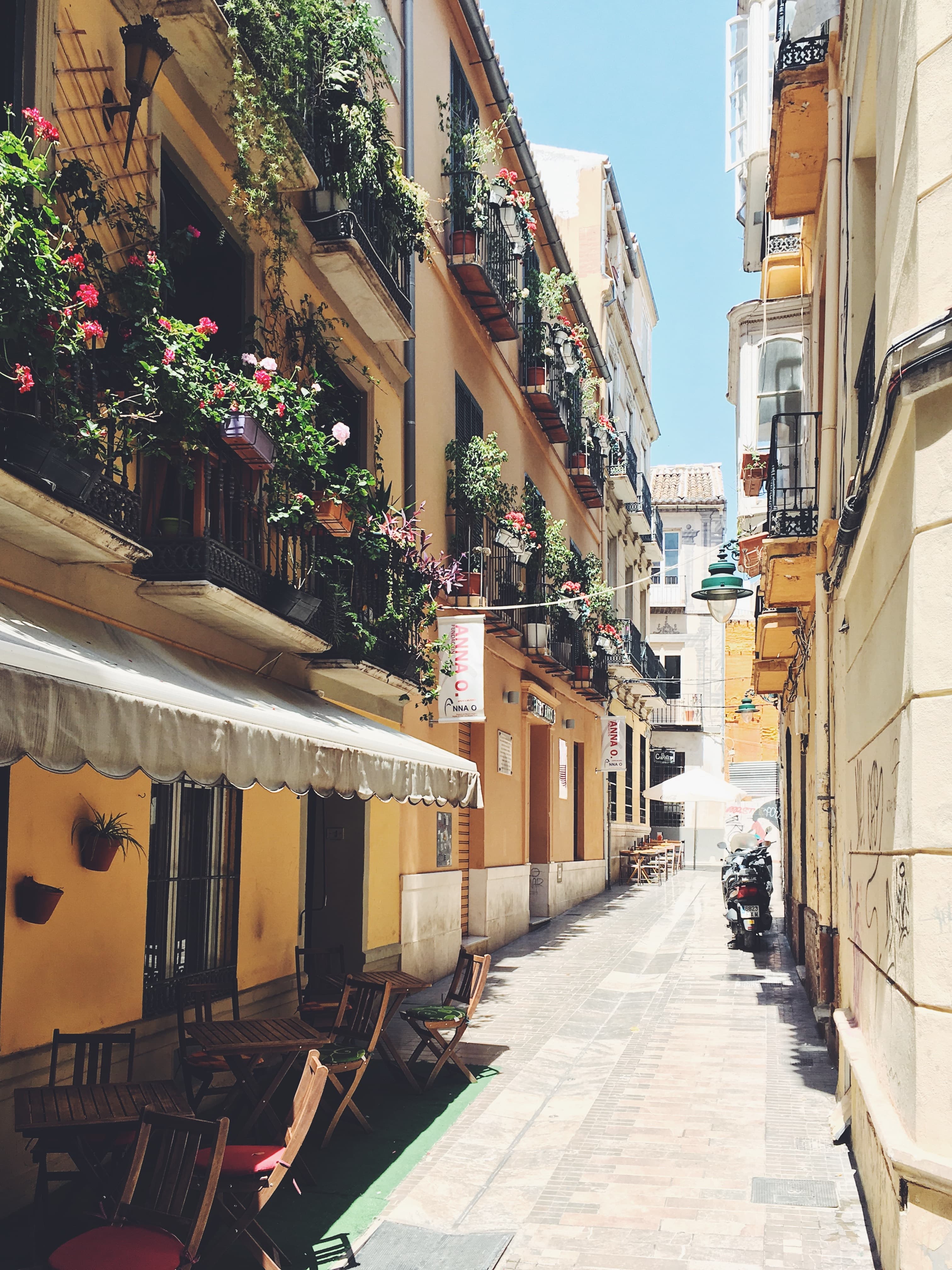 ESAGP Malaga empty seats and tables in between buildings during daytime Jonas Hoss.jpg